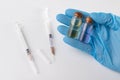 A small syringe, medicine and doctor& x27;s hands in gloves. Utensils necessary for treatment at the clinic Royalty Free Stock Photo