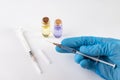 A small syringe, medicine and doctor& x27;s hands in gloves. Utensils necessary for treatment at the clinic Royalty Free Stock Photo