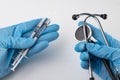 A small syringe, medicine and doctor& x27;s hands in gloves. Utensils necessary for treatment at the clinic Royalty Free Stock Photo