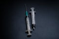 A small syringe into which a hollow, sharp-pointed bevel-cut needle is inserted Royalty Free Stock Photo