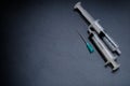 A small syringe into which a hollow, sharp-pointed bevel-cut needle is inserted Royalty Free Stock Photo