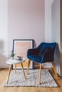 Small table and designer chair in apartment interior