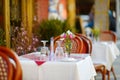 Small table set for dinner in outdoor cafe in Little Italy neighborhood in downtown Manhattan, New York City Royalty Free Stock Photo