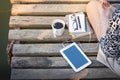 Small tablet on wood bridge Royalty Free Stock Photo