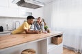 Small talks. Man and woman standing in the kitchen chitchatting while they drinking coffee after female come back home from her Royalty Free Stock Photo