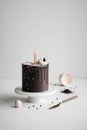 Small chocolate cake wih sprinkles and candles, minimalistic scandinavian style, generative AI