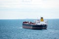 Small tanker ship `Sea Glamour` sailing through calm, blue sea. Royalty Free Stock Photo