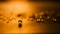 Small, tansparent balls abstract with bokeh and orange Royalty Free Stock Photo