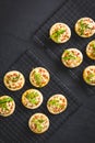 Small tarte flambee or mini pizza with onion, bacon and arugula Royalty Free Stock Photo