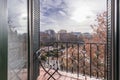 Small terrace with artistic wrought iron railing overlooking a beautiful urban park on a winter day Royalty Free Stock Photo