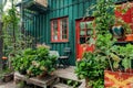 Small terrace with plants in wooden village house of Christiania Freetown, old hippie comunity