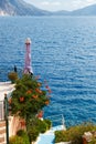 Small terrace and traditional greek blue stairs with sea view in Asos village. Fantastic azure sea water of Cephalonia Royalty Free Stock Photo