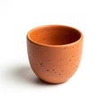 Small terracotta cup with a smooth, rounded shape on a white background Royalty Free Stock Photo