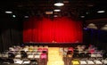 Small theatre hall with red curtains, stage and chairs Royalty Free Stock Photo