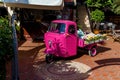 A small three-wheeled car stands on the empty street Royalty Free Stock Photo