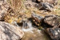 Small threshold - waterfall on the narrow but full-flowing and non-drying bed of the Tavor River, in the Galilee, near the Afula Royalty Free Stock Photo