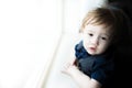 Small toddler boy gazing out Window Royalty Free Stock Photo