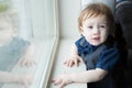 Small toddler boy gazing out Window Royalty Free Stock Photo