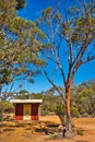 Small toilet building on a remote camping ground in the Australian outback Royalty Free Stock Photo