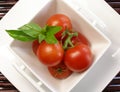 Small tomatoes with basil 2 Royalty Free Stock Photo