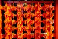 Small torii shrine with visitors\' names hanging inside the temple for good luck