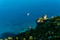 Small tourist boat in the sea near rocky shore, aerial view Royalty Free Stock Photo