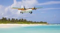 A Small Tourist Plane Soars Over the Idyllic Caribbean Beach Royalty Free Stock Photo