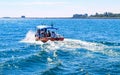 Small tourist ship with the passengers. Beautiful seascape with a tourist boat. The ferry just left the pier. Royalty Free Stock Photo