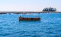 Small tourist ship with the passengers. Beautiful seascape with a tourist boat. The ferry just left the pier. Royalty Free Stock Photo