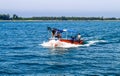 Small tourist ship with the passengers. Beautiful seascape with a tourist boat. The ferry just left the pier. Royalty Free Stock Photo