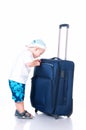 Small tourist with suitcase on white background