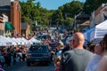 Small town Applefest parade with crowd and booths lining the route