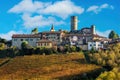 Small town on the hill with autumnal vineyards in Italy Royalty Free Stock Photo