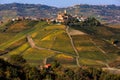 Small town on the hill with autumnal vineyards in Italy. Royalty Free Stock Photo