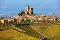 Small town on the hill with autumnal vineyards in Italy Royalty Free Stock Photo