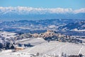 Small town on the hills covered in snow in Northern Italy.
