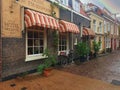 A small town hotel on a street in a classical Dutch style