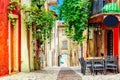 Small town narrow street view with colorful houses in Malcesine, Italy during sunny day. Beautiful lake Garda