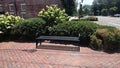 Small Town sitting area bench flowers Royalty Free Stock Photo