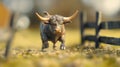 A small toy bull is depicted in a dynamic, charging pose Royalty Free Stock Photo