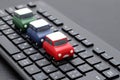 Small toy car on computer keyboard