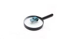 Small toy car on a magnifier white background Royalty Free Stock Photo