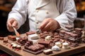 Small toy chocolatier making chocolates