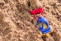 Small toy digger working on sand quarry, construction concept Royalty Free Stock Photo