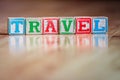 Small toy wooden blocks spelling word travel Royalty Free Stock Photo