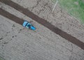 Small tractor ploughing in the field. Royalty Free Stock Photo