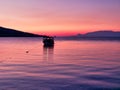 Small Fishing Boat in Corinthian Gulf Bay at Dawn, Greece Royalty Free Stock Photo