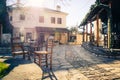 Small traditional paved square with cafe and authentic narrow streets in Nissaki, Ioannina.