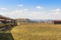 Small trains in Huanghuagou Huitengxile geological park near Hohhot, Inner Mongolia, China, with clouds and blue sky and wind