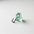 It is a shiny metallic fish hook with a sharp point and barb Royalty Free Stock Photo